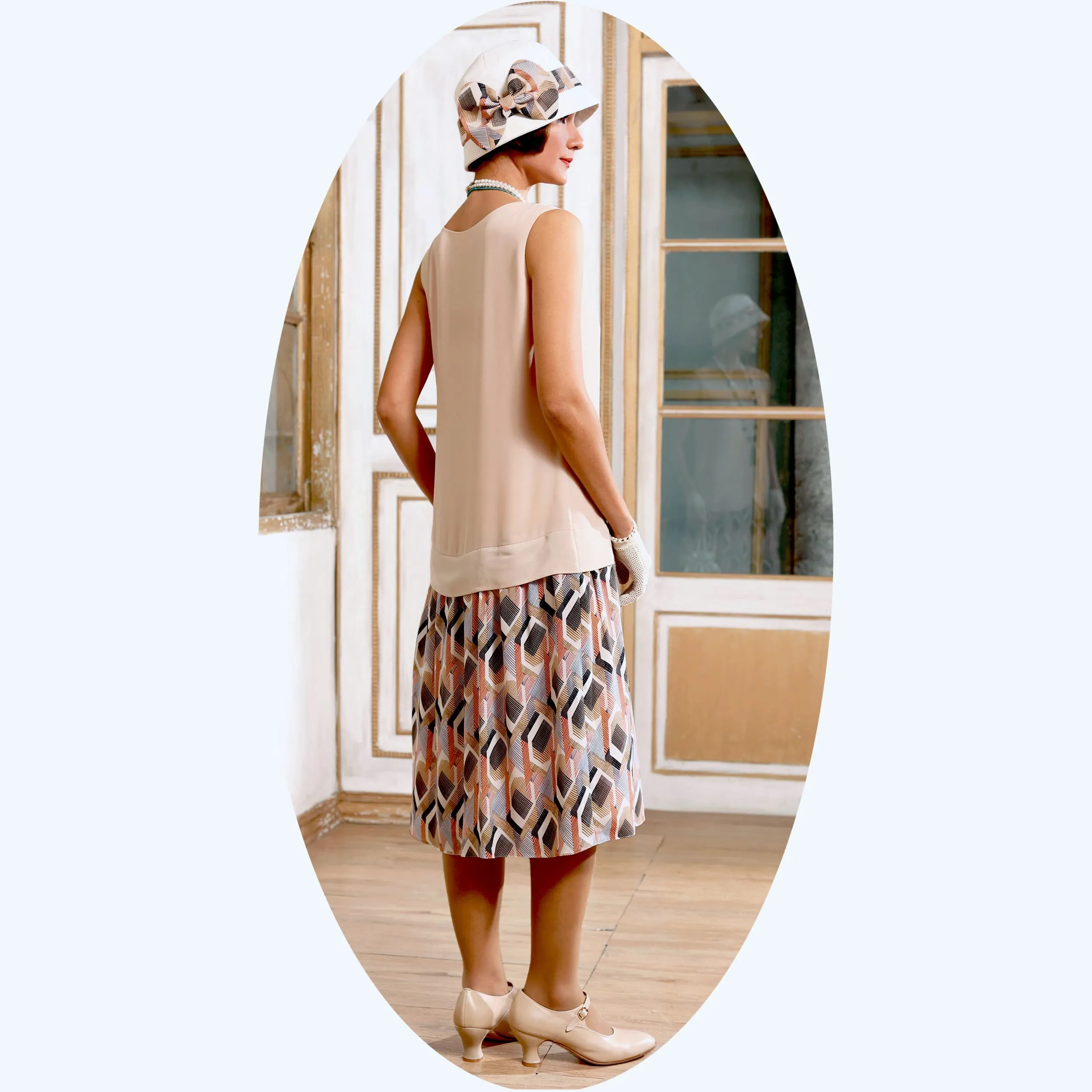 Vintage inspired 1920s dress with nude and printed skirt